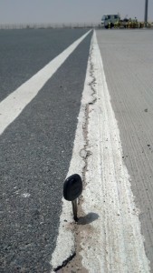 Crack between asphalt and concrete pavement at airport