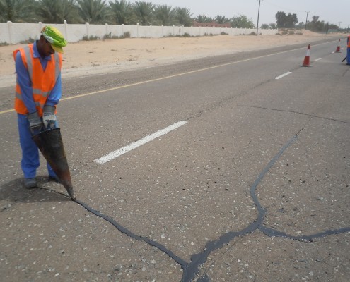 Sealant application to asphalt crack by cone